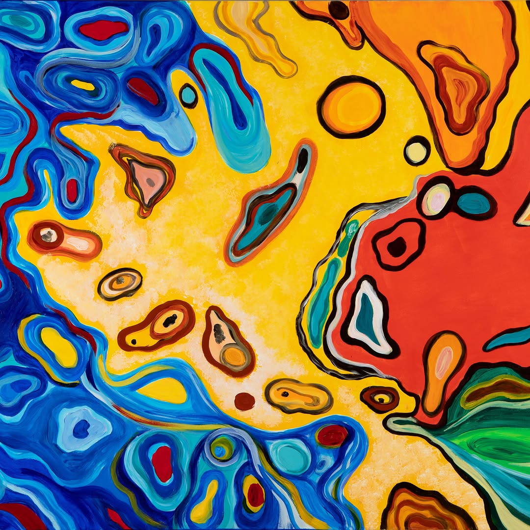 A colorful abstract painting with geometric forms and layered horizontal bands, shown in a tightly framed view under bright lighting.